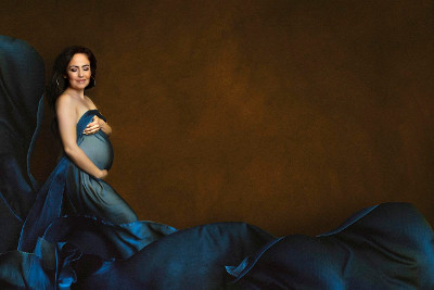 Expectant mother in blue gown