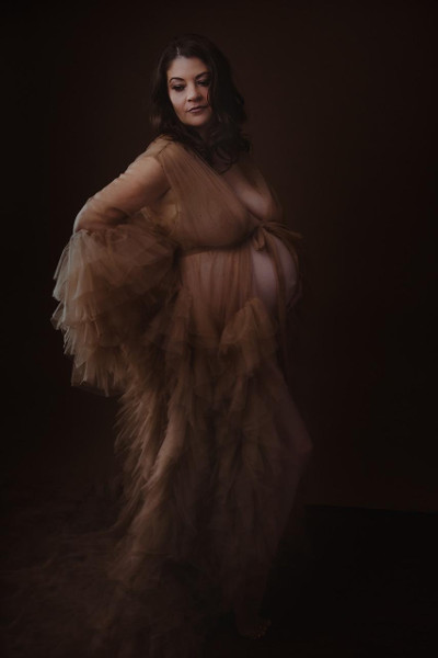 Expectant mother in gown with frills